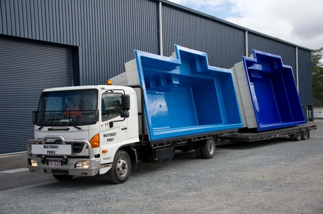 Pool loaded onto crane truck London